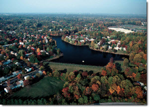 Aerial view of fall trees surrounding a lake Aerial view of fall trees surrounding a lake
