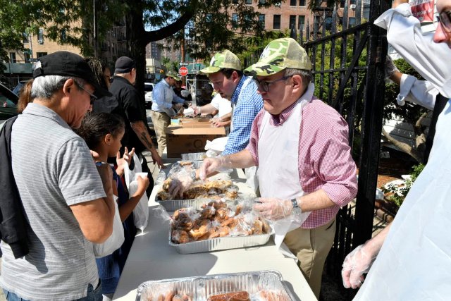 Administrator Wheeler serving food diverted from Yankees Stadium