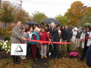 Luis Marin School Outdoor Classroom: Neighborhood Environmental Demonstration Site Ribbon Cutting Ceremony (Richard Tiani, Groundwork and Stacey Johnson-Pridgeon, EPA hold the ribbon as Mayor Bill Finch cuts it, Luis Marin School Associate Principal Olga
