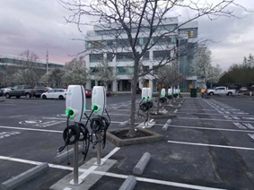 Picture of parking lot with universal electric charging ports installed.