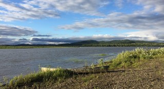 A canoe beside the lake 