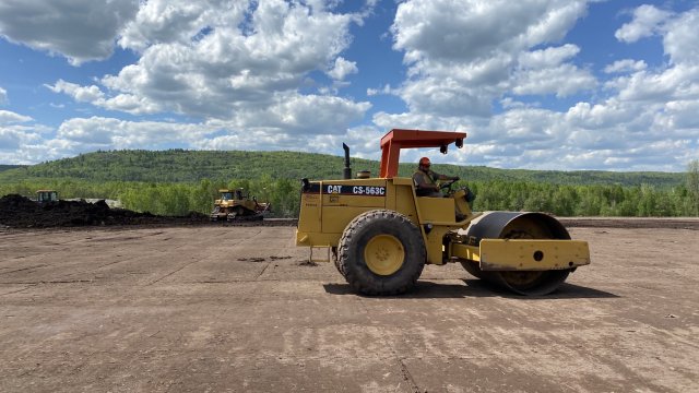 A smooth drum roller is used to compact soil in the OU-J confined disposal facility (CDF) prior to placement of impacted material.
