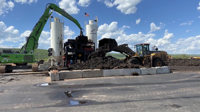 Impacted sediment is mixed with Portland cement at the sediment processing area prior to placement in a confined disposal facility (CDF).