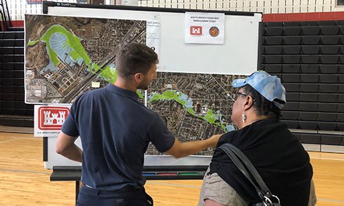 Community members looking at a map