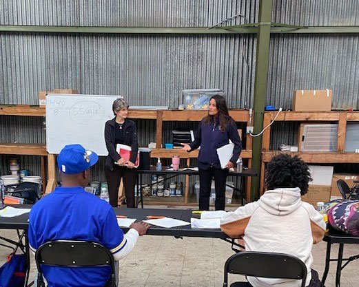 Deputy Administrator Janet McCabe, standing in front of the white board, next to Regional Administrator Martha Guzman, at the Hunter&rsquo;s Point