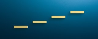 Steps against a wall symbolizing a process