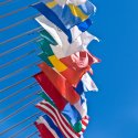 Multiple international flags flying