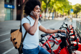 Man talking on the phone in front of bikes